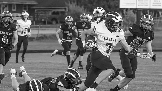 Glen Lake senior Boden Fisher breaks a tackle against Reed City on Friday. The Lakers will travel to East Jordan Friday at 7 p.m.