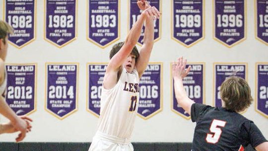Enterprise photos by Brian Freiberger Leland guard Brady Keen attempts a 3-point shot against Kingsley during a 57-45 loss on Tuesday.