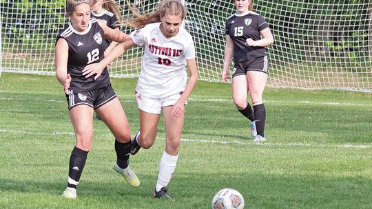 Glen Lake senior Paige Steffke and Suttons Bay sophomore Megan U’Ren battle for possession during a Northwest Conference soccer game in 2023. Enterprise photo by Brian Freiberger