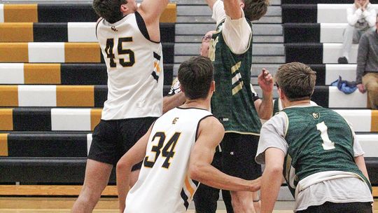 Glen Lake junior Jacob Plamondon tips off the season against TC West Tuesday during a scrimmage. Enterprise photo by Brian Freiberger
