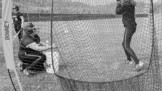 Glen Lake seniors Paige Flores (right) and Ella Flores (left) practice for the upcoming softball season. The Lakers had their first game on the road yesterday against Lake Leelanau St. Mary. Enterprise photo by Brian Freiberger