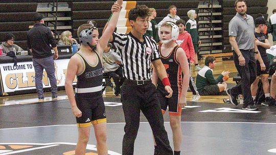 Glen Lake middle school wrestler Dylan Morgan gets his hand raised after defeating a Kinglsey wrestler on Tuesday. Enterprise photos by Brian Freiberger