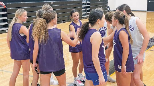 The Leland girls basketball team breaks down the team huddle before hitting the court for one of the first practices of the season. Enterprise photo by Brian Freiberger