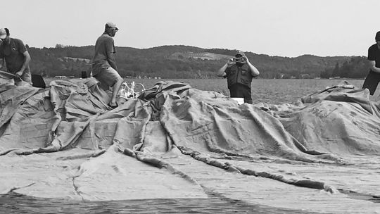 Large burlap blankets block sunlight to Eurasian watermilfoil (EWM), an invasive located in Lake Leelanau. Enterprise file photo