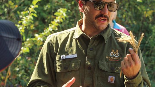 Collin Gaudard, head distiller at Mammoth Distilling, talks about the history of growing Rosen rye on South Manitou Island. Enterprise photo by Brian Freiberger
