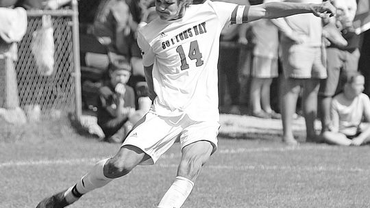 Suttons Bay senior Finn Mankowski drills a free kick against Leland in the fall of 2023. Mankowski will be heading to Costa Rica as he made the USMNT (U-19) soccer team. Enterprise photo by Brian Freiberger