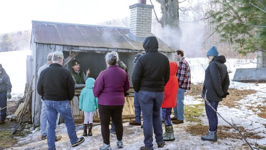 Ranger Matt explains the maple sugaring process while standing inside the sugar shack at Dechow farm. Photo courtesy of the National Park Service. Courtesy photo