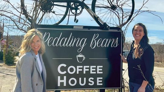 Mary (right) and Becky (left) Lingaur celebrate a transition of ownership at the end of March. Mary became the new owner of Pedaling Beans on April 1. Courtesy photo