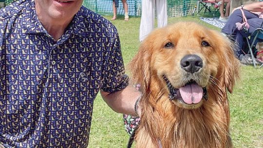 Jeff Rabidouz and his dog ‘Blu’ pose for a photo after ‘Blu’ finished third at the Ultimate Air Dog Competition during the Cherry Festival in Traverse City. Courtesy photo