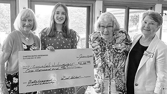 Members of Chapter EM, P.E.O. Suttons Bay present a check to Amabel Schwaiger, the 2024 Betty Maynard Memorial Scholar. Amabel is a graduate of Leland High School and is attending Washington University. Pictured are Gail Hetler, Amabel, Barbara Marsh and Mary Bantle.