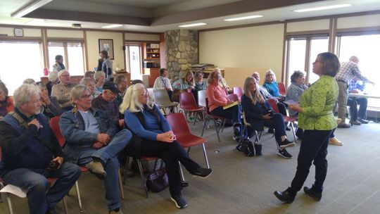 Kama Ross, Leelanau County’s District 5 commissioner and a member of the Leelanau Energy Futures Task Force, welcomes a roomful of event attendees to an Earth Day discussion panel at Leland Public Library. The event featured presentations from a part-time assistant professor at Wayne State...