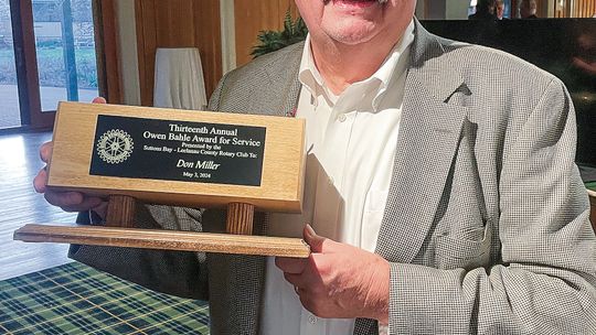 Glen Lake legendary teacher and coach Don Miller was honored Friday as the 13th Annual Owen Bahle Award for Service. Enterprise photo by Brian Freiberger