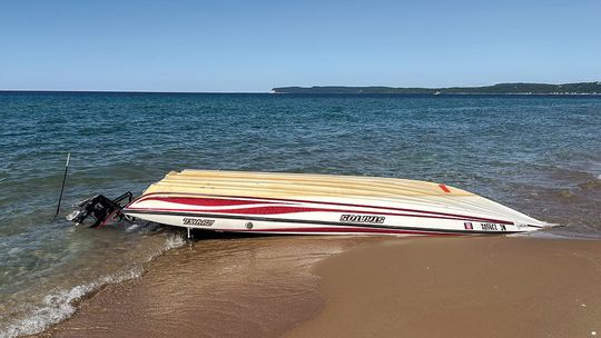 The U.S. Coast Guard and Park Service staff have been busy with two boat mishaps on Lake Michigan Friday and Saturday. Two fishermen were rescued Friday after their boat went down off Frankfort. This boat washed up on Sleeping Bear Point. The body of a downstate man whose kayak turned over...