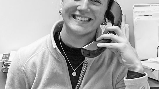 Junior Catherine Mikowski is all smiles as she works the phone during the St. Mary School Alumni Phonathon. Courtesy photo