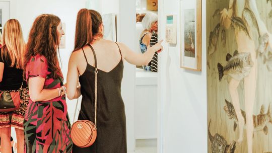 V Gallery in Omena held its first group exhibition, “Night of Nudes,” on Friday night. The artwork focused on night scenes and the nude form and was depicted through mediums like paintings, sculptures, photography, textile, and jewelry. Photo courtesy of Shannon Scott Photography