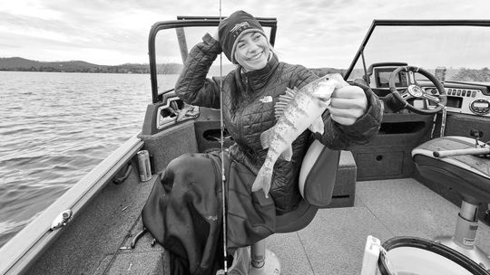Emilee Ballant, a senior at Michigan State, enjoyed Christmas Day on Glen Lake with a bucketful of perch. Courtesy photo
