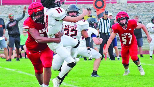 Suttons Bay defensive lineman Zachariah Raphael ran through the Mesick offensive line to pressure the quarterback during a win to start the season. Photos courtesy of Cynthia Opie