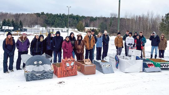 Northport students race cardboard sleds at Braman Hill
