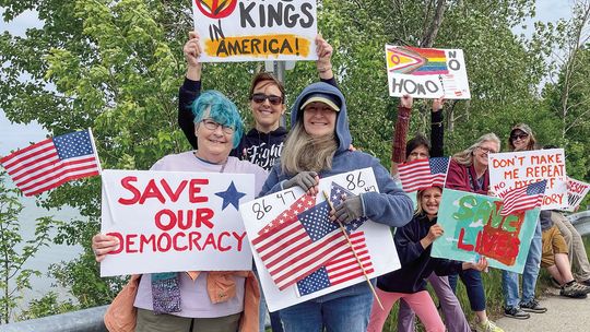 People gathered peacefully at the Narrows in Glen Arbor Saturday to participate in a "No Kings