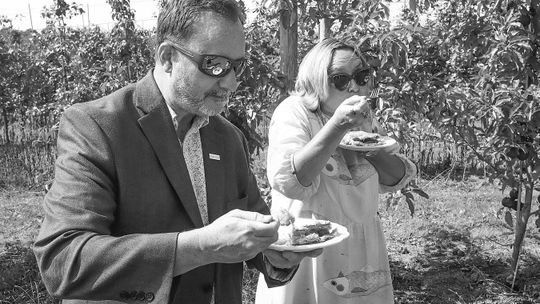 The Grand Traverse Pie Company unveiled its Pure Michigan Maple Glazed Apple Pie on Monday at the Northwest Horticultural Center in Bingham Township on Monday. Nikki Rothwell (right) and Pure Michigan Relations Director Nick Nerbonne test the new pie in a Leelanau County apple orchard. Ent...