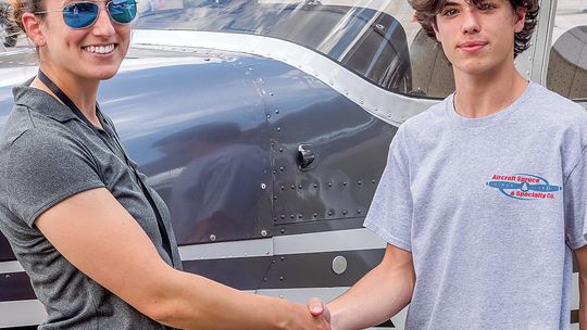 Joel Plamondon accepts an $11,000 scholarship to further pursue aviation. The high school juniors will be pursuing a career in aviation with the hopes of becoming a commercial airline pilot. Courtesy photo