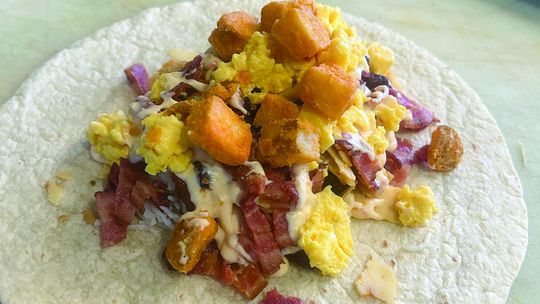 The spicy bacon breakfast burrito is a restaurant week menu special item at New Bohemian Cafe available from April 27-May5. The business will also have deals on items like a honey almond latte for $5, a breakfast deal that includes any breakfast burrito and a drip coffee or cold brew for $...