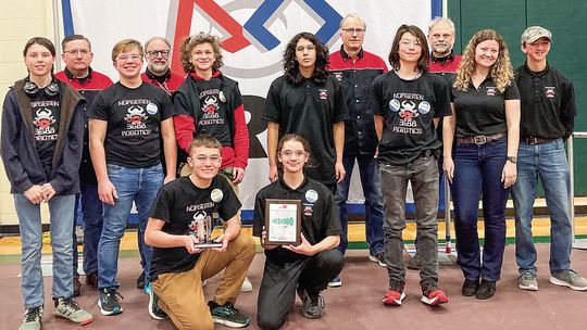 The Norsemen Robotics team poses after receiving the Quality Award at Traverse City West Senior High School. Front row from left to right: Team members Jacob Gulley and Casey Porter. Middle row left to right: Team members Koen Kruk, Anthony Grant, Jack Shiner, James Miller, Michael Rokita,...