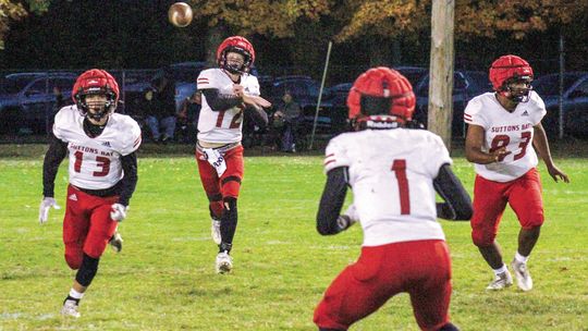 Suttons Bay senior quarterback Grayson Opie throws a dart to a wide receiver during a 43-0 win over Mesick Friday.