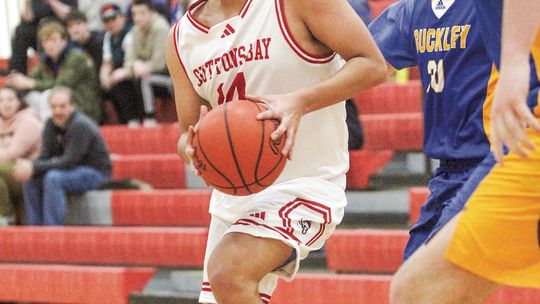 Suttons Bay junior Darius Lopez drives the lane before finding a teammate during a Northwest Conference boys basketball game on Monday against Buckley. Enterprise photo by Brian Freiberger