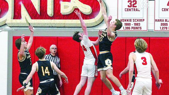 Glen Lake senior Dylan Cundiff blocks a Benzie shot during a Northwest Conference championship game last week. Enterprise photos by Brian Freiberger