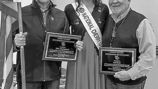 Two long-time cherry industry advocates were provided distinguished service awards in 2024 by the Cherry Marketing Institute. From left are Mike Van Agtmael, National Cherry Festival queen Carmen Beemer, and Jeff Send from Leelanau County. Courtesy photo
