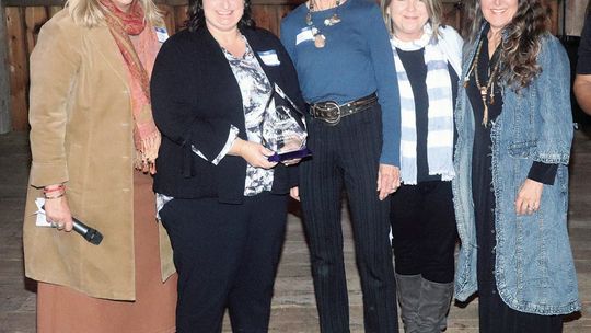 The Leeleanau Chamber of Commerce awarde Sharecare with the 2024 Business of the Year Award Thursday during a banquet at French Valley Vineyards. From left to right: Jamie Jewell, Dawn Bousamra, Dale Lersch, Sally Bancroft and Jennie Arguello accept the 2024 business of the year award for...
