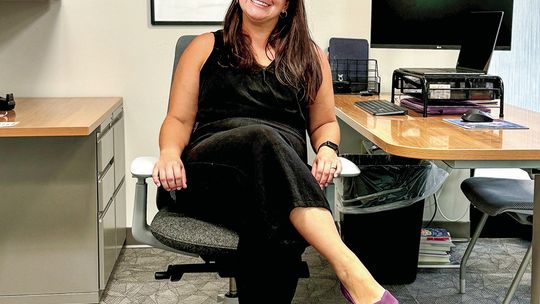 Shelagh Fehrenbach, pictured here in her new office, is not only a 2005 alumnus of Leland Public School, but will serve as the new K-12 principal for the district this year. Courtesy photo