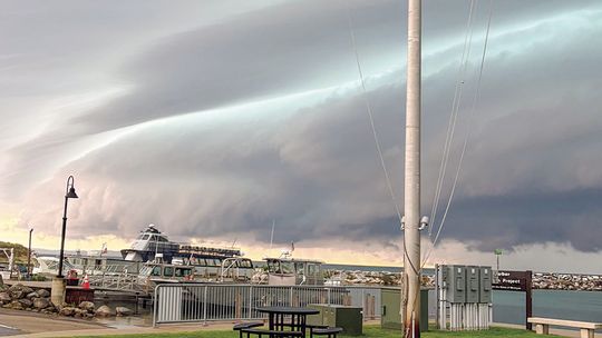 Skies over Fishtown were dark and foreboding as a historic flooding took place Monday in Northport