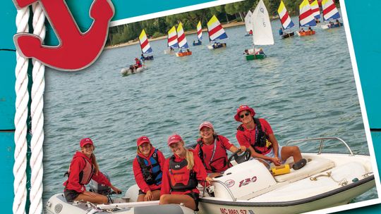Some of the staff with the Northport Youth Sailing School are pictured last season with students from the program practicing their sailing skills on Northport Bay. Photo courtesy of Glenn VanOtteren