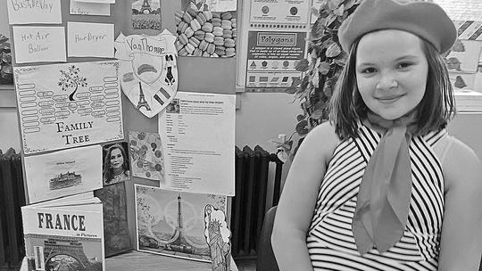St. Mary fourth grader Aubrey VanThomme researched her family history and culture as part of the school’s annual Ancestry Day last week. She chose France in honor of her family history, researching it and reporting her findings through interactive displays. Students create a family tree, l...