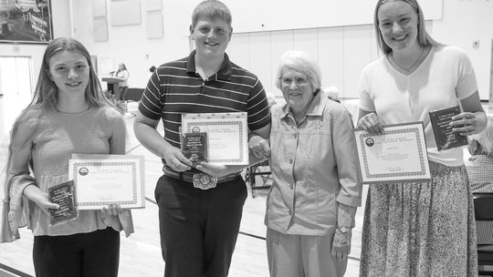Kendra Couturier and Leah Fleis were awarded the Bruce Floyd &amp; Lisa Elaine Price Memorial Scholarship by Betsey Price while Will Grant was awarded the Bruce Warren Price Memorial Scholarship by Betsey Price. Pictured from left are Couturier, Grant, Price and Leah Fleis. Courtesy photo