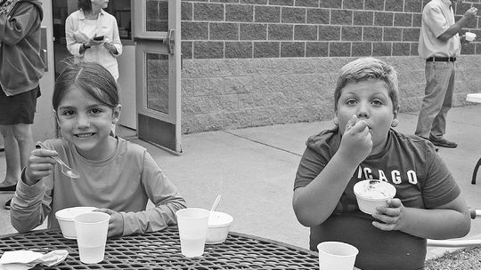 St. Mary students Maggie and Walter Campillo enjoy a back-to-school ice cream social. Enterprise photo by Brian Freiberger