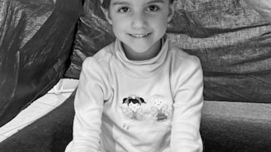St. Mary Preschooler Margaret Campillo reads in the book nook tent during the ‘Pop Open a Good Book’ reading event. Courtesy photo