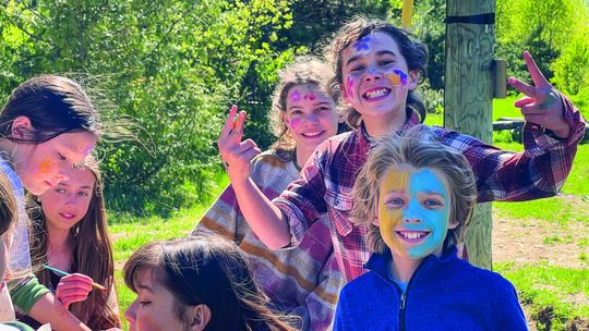 Students at Leelanau Montessori happily lined up for face painting outdoors at the school's annual Stone Soup event last Wednesday