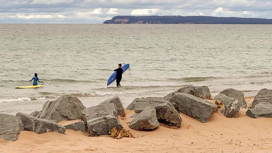 Surf boarders donned wet suits before heading out on Lake Michigan