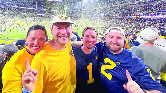 Michigan alumni with Leelanau ties are filled with joy after the Wolverines won the College Football Playoff National Championship against Washington on Monday. From left to right: Chelsea Suttmann, Noah Suttmann, Jonathon Williams, and Logan Suttmann smile as the confetti falls in Houston...