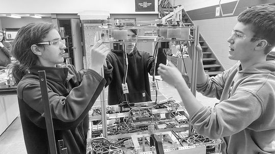 Suttons Bay Norsemen robotics team members (from left to right) Casey Porter, Dean Hulett, and Jacob Gulley, are pictured assembling their robot. Courtesy photos