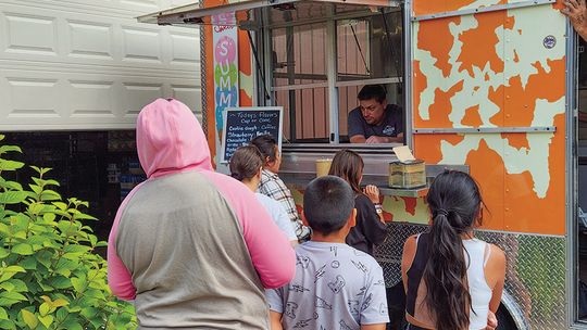 Buchan’s Scoops 22 ice cream truck treated volunteers and patrons at Leelanau Christian Neighbors Monday. Enterprise photo by Brian Frieberger