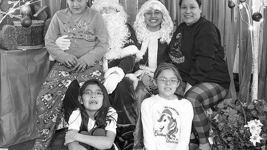 New Grand Traverse Band of Ottawa and Chippewa Indians’ (GTB) cultural department assistant/program director TaShena Sams is pictured with her three kids, Maiingan, Faith and Hope, at Christmas. Sams has been employed and working for the tribe for over 20 years now. Photo courtesy of TaShe...