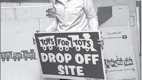 The annual Toys for Tots campaign began this week when volunteer Sharon Husted and her cohorts distributed collection boxes throughout the county. Enterprise photo by Amy Hubbell