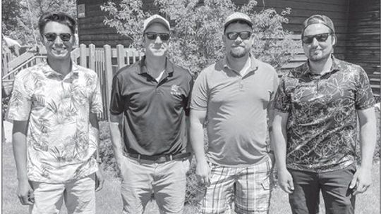 The four-person scramble team (from left to right) Ethan Piño, Adam Brown, Cameron Kilcherman, Brandon Kilcherman, shot a 56 (-16) to win the Suttons Bay Booster golf outing at Bahle Farms on Sunday, May 19. Enterprise photo by Brian Freiberger