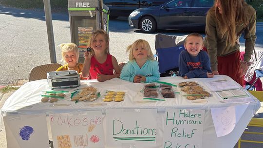 The grandchildren of Barb and Keith Plamondon of Lake Leelanau held a bake sale Friday with proceeds going to hurricane relief. Also photographed, right, is mother/aunt Melissa Cholowinski. See story on Pg. 13. Photo courtesy of Joe Hubbell
