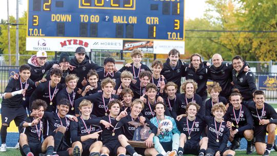 The Leland soccer team celebrates after winning