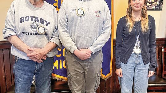 The Suttons Bay-Leelanau County Rotary said goodbye to outbound exchange student Rebeccca Nieberg and welcomed Caleb Hall, who just returned from a year abroad in Finland. Pictured from left are: Youth Exchange officer Wayne Wunderlich, Hall and Nieberg. Enterprise photo by Amy Hubbell